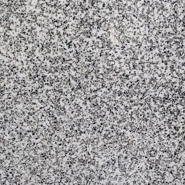 Epoxy floor colour and finish sample: dense black and grey chips on a white base