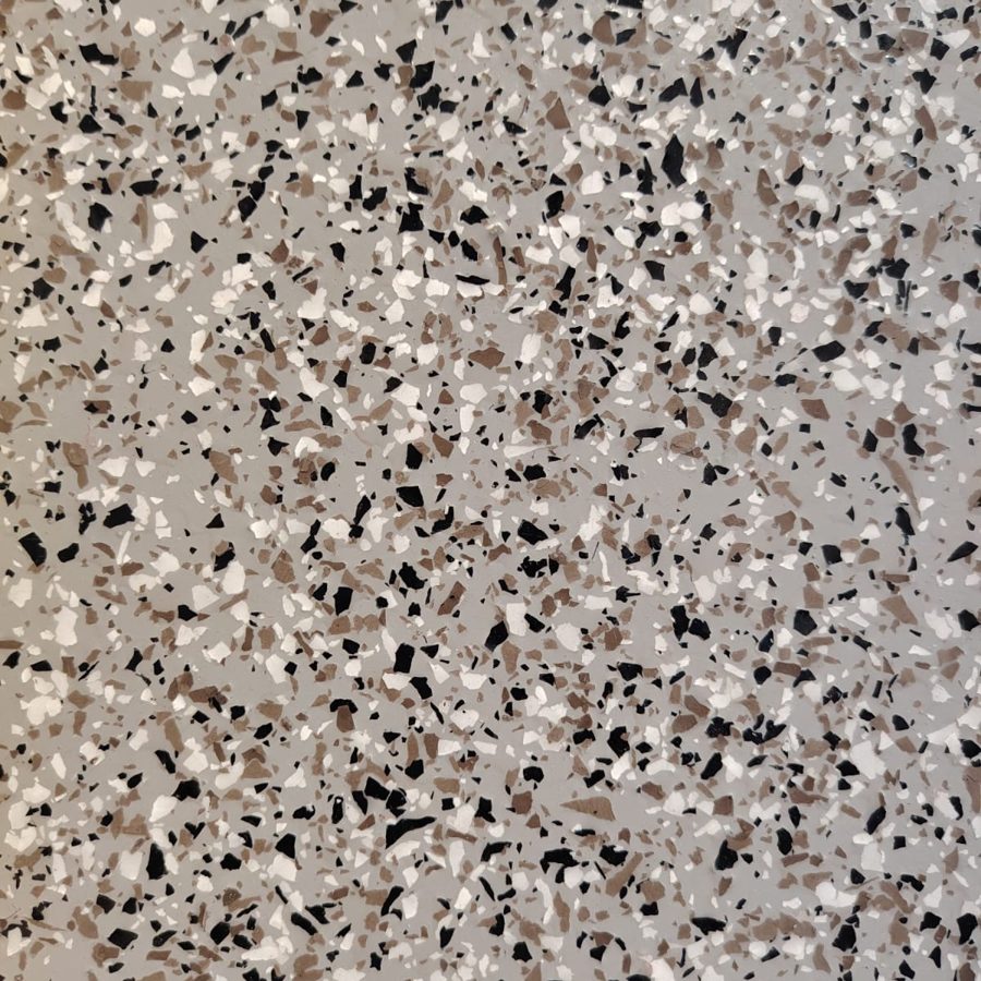 Epoxy floor colour and finish sample: dense black, brown and white flakes on grey