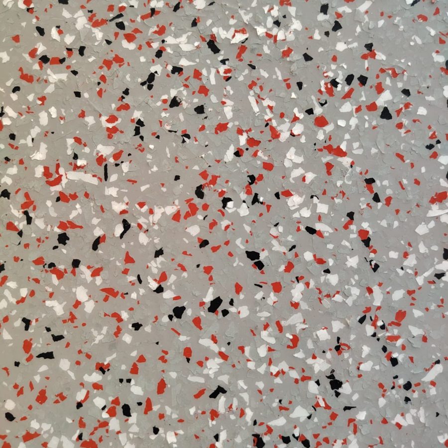 Epoxy floor colour and finish sample: red, black and white flakes on grey